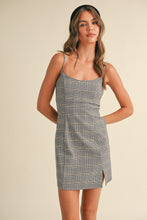 Load image into Gallery viewer, Woman wearing a plaid dress against a beige background
