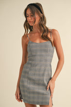 Load image into Gallery viewer, Woman wearing a plaid dress against a beige background
