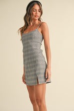 Load image into Gallery viewer, Woman wearing a plaid dress against a beige background
