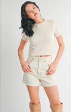 Load image into Gallery viewer, Woman wearing a beige crop top and shorts with tan boots on a white background
